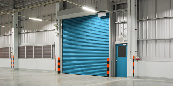 Roller door or roller shutter using for factory, warehouse or hangar. Industrial building interior consist of polished concrete floor and closed door for product display or industry background.